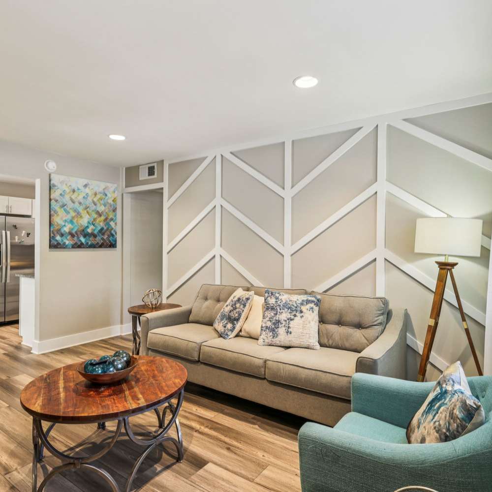 Stylish and welcoming living room with decorative furnishings at The Ashley in Columbia,Tennessee