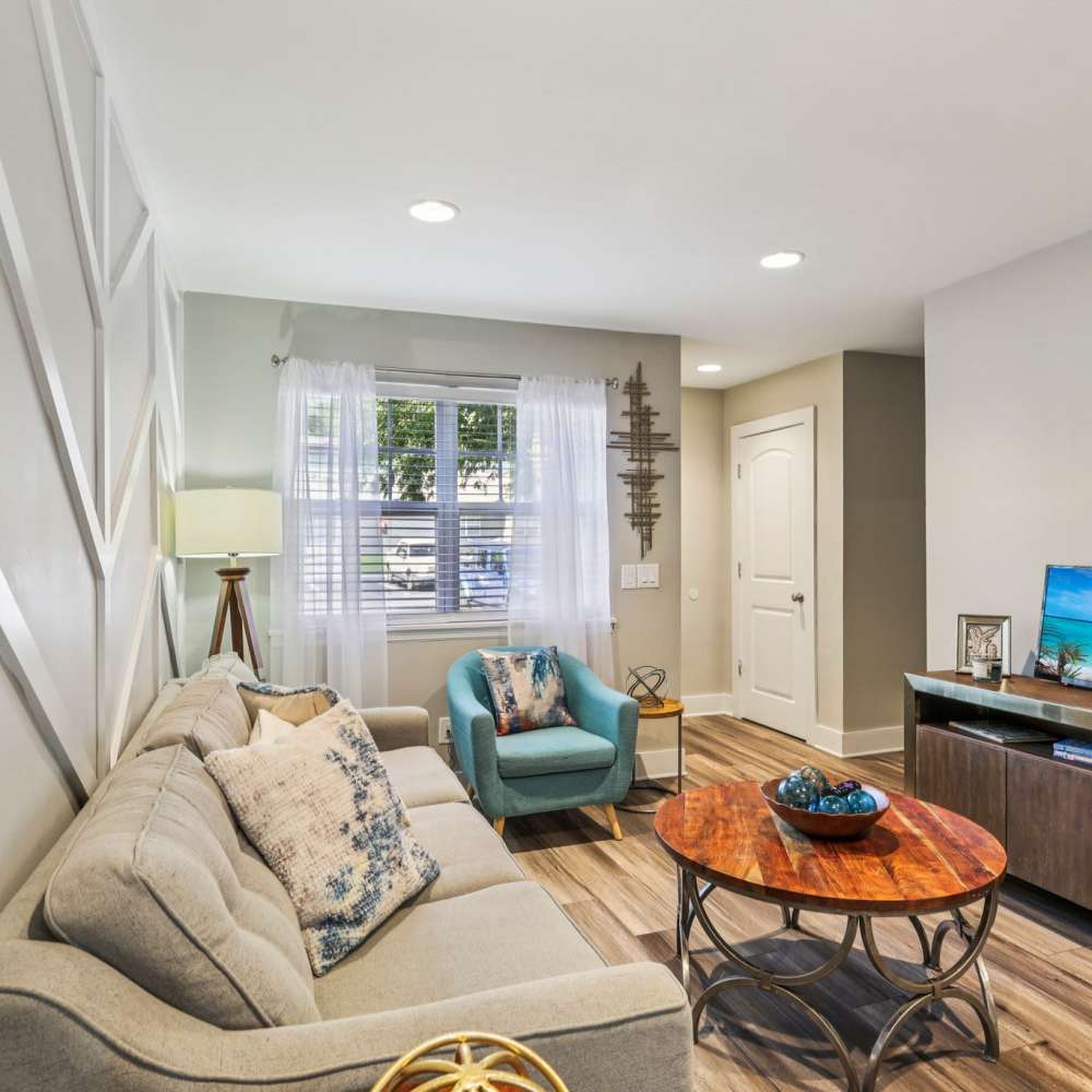 Stylish living room with wooden center table at The Ashley in Columbia,Tennessee