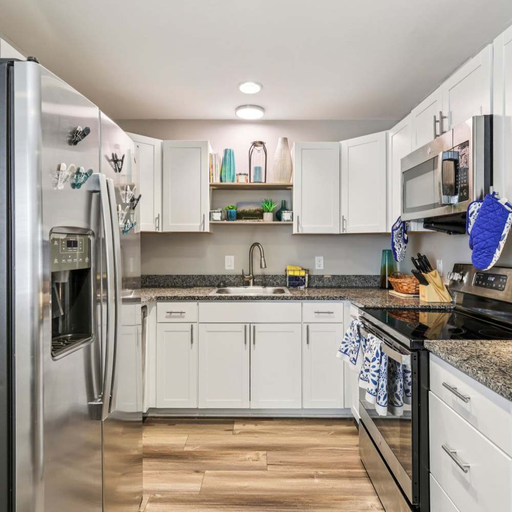 Well-equipped kitchen with white cabinetry at The Ashley in Columbia,Tennessee