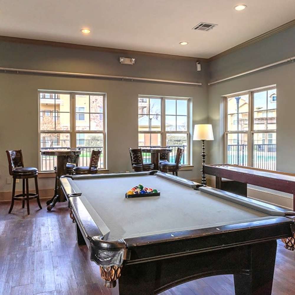 Bright game room featuring a pool table and cozy seating options at Blue Ridge in Midland, Texas