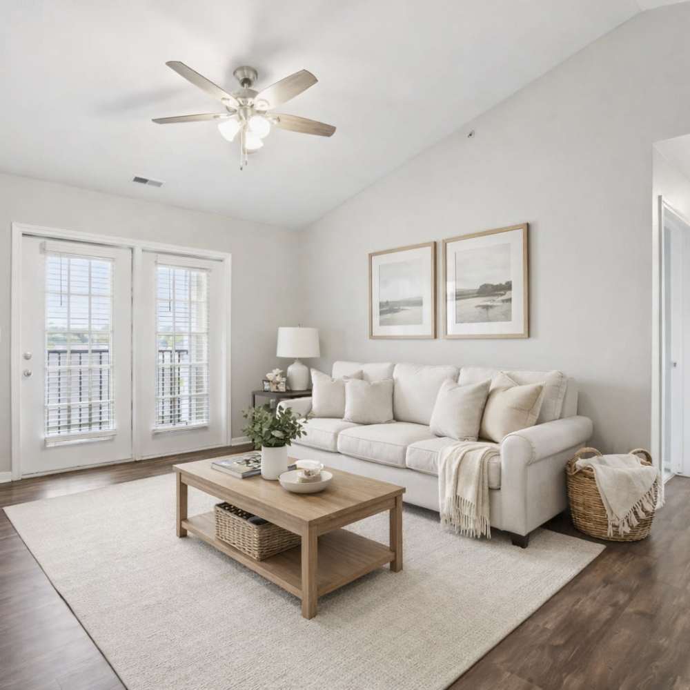 Living room with a comfortable couch and a TV at City View Farm Apartments in Franklin, Indiana