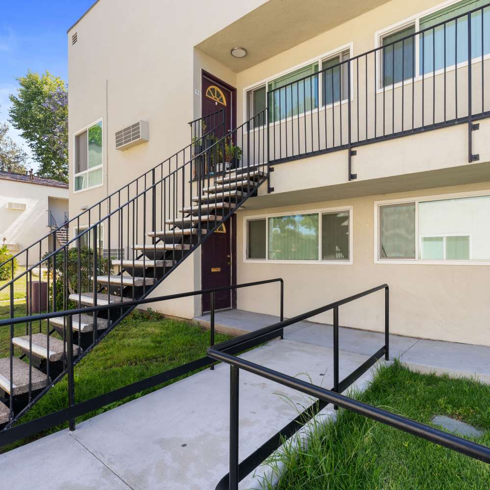 building entrance with staircase to second floor Kings Villages in Pasadena, California