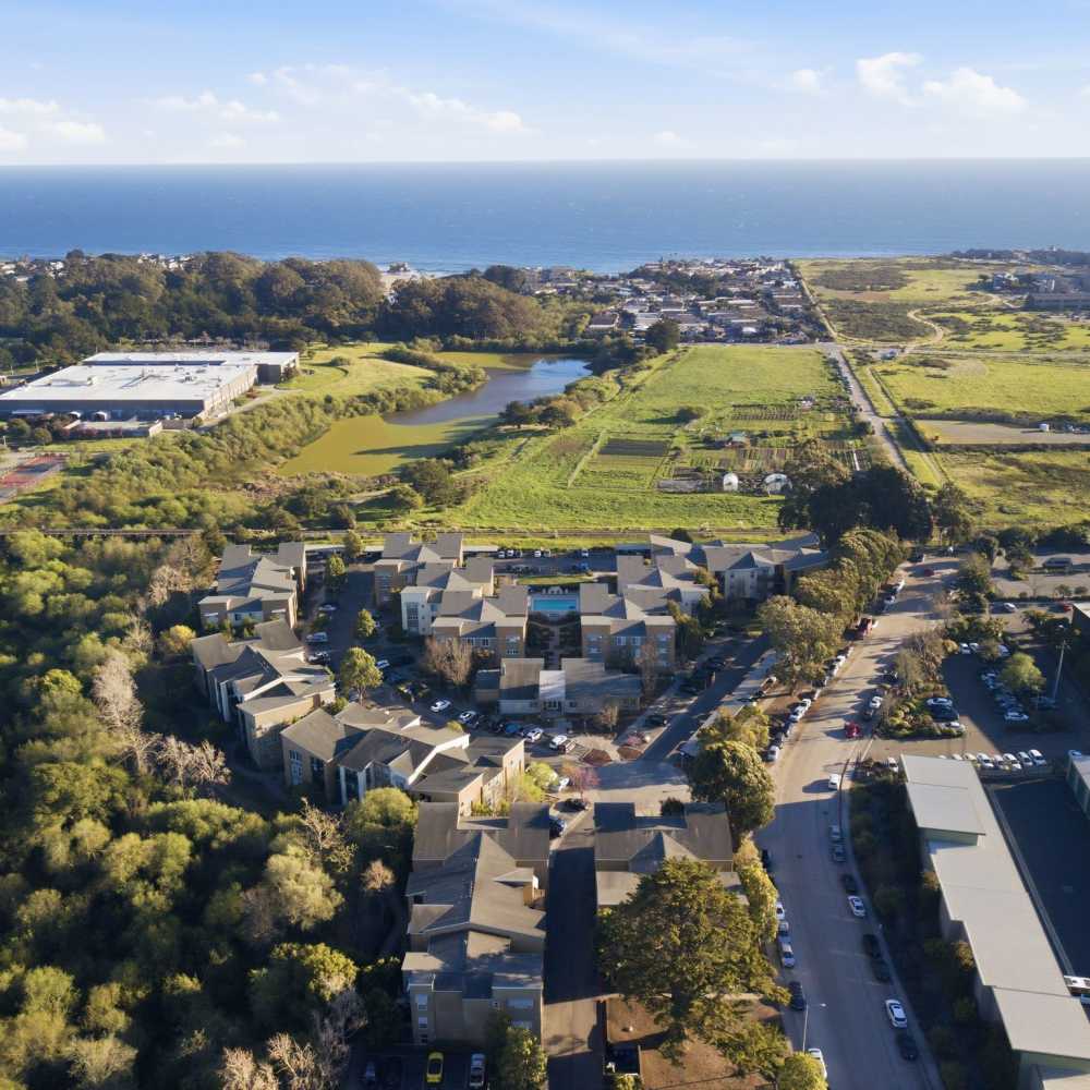 Residents bicycling in the beach near Pacific Shores in Santa Cruz, California