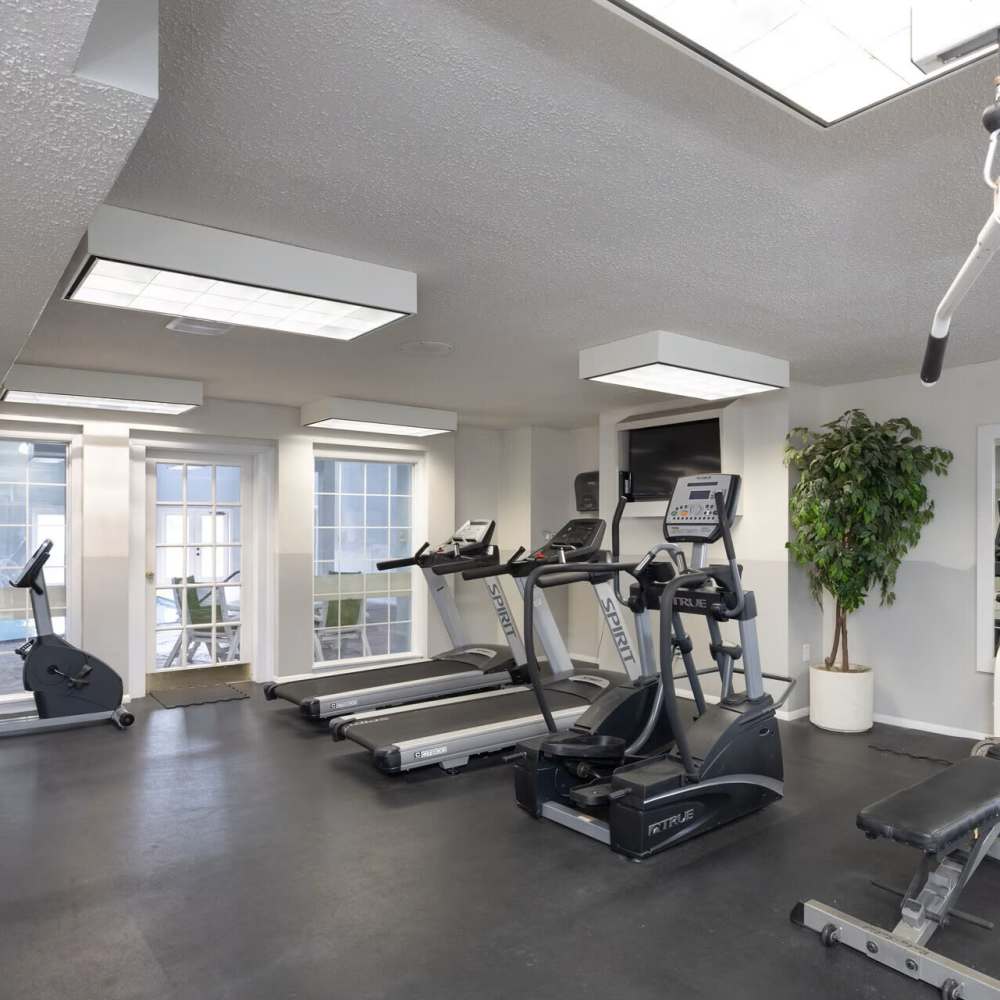 Fitness center with treadmills at Village Green Apartments in Chesterfield, Missouri