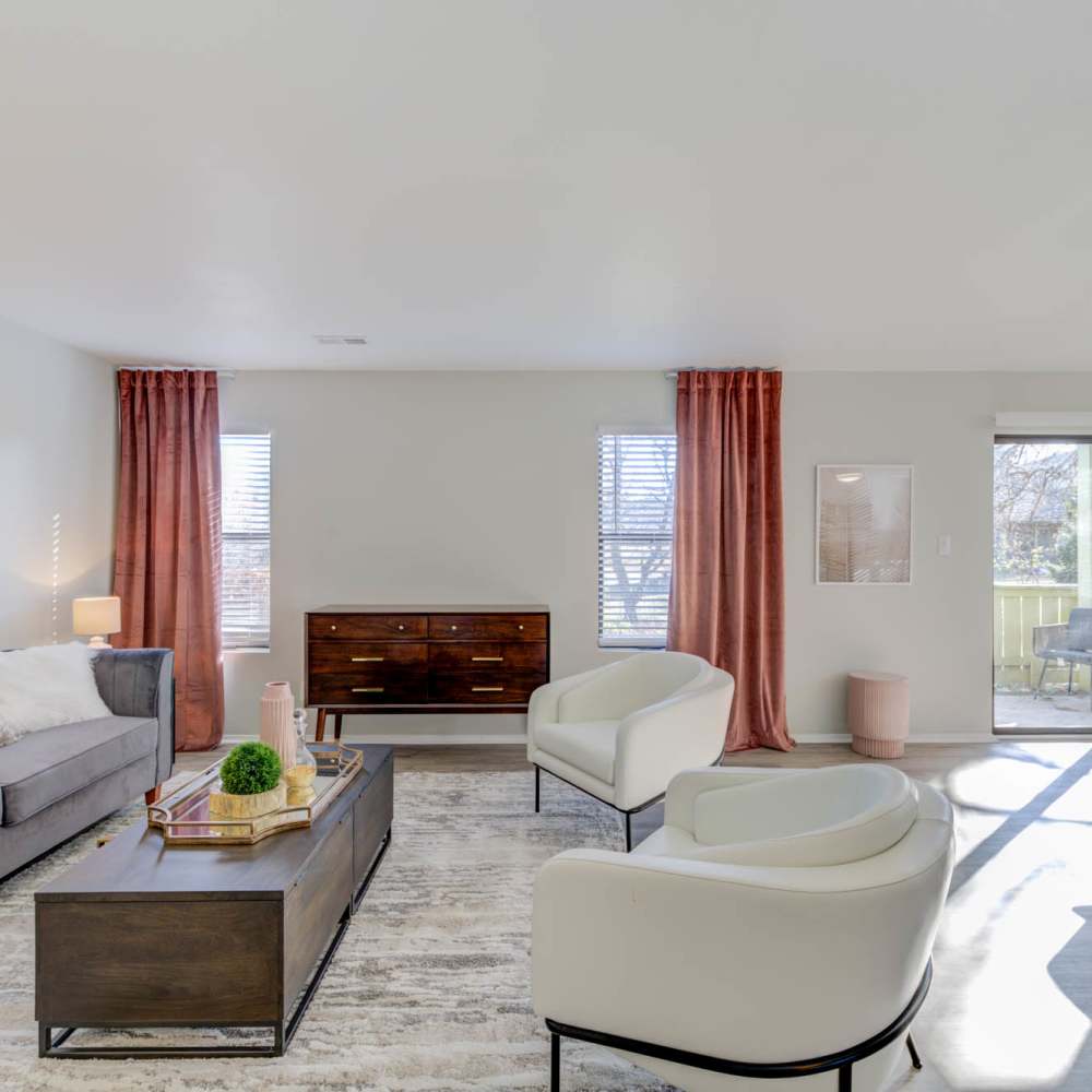Living room with a TV at Lago Vista Apartments in St. Charles,Missouri