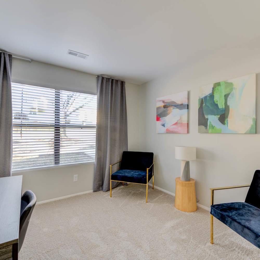 Well-lit room with a large window at Lago Vista Apartments in St. Charles,Missouri