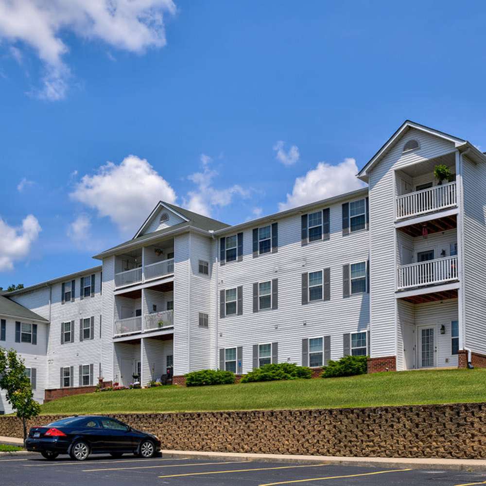 Building exterior with parking at Beaumont Greene Senior Living in Athens, Ohio