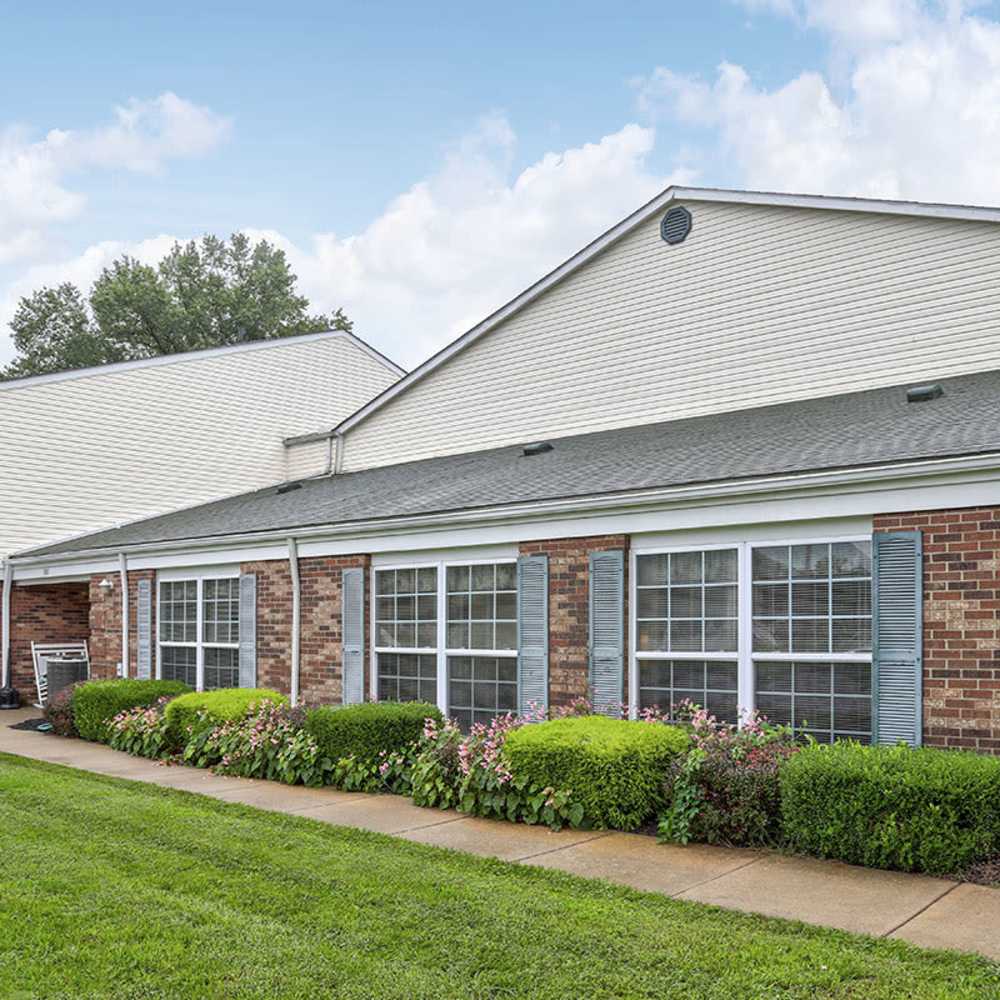 Building exterior with landscaped garden at Riverview Place in Ripley, Ohio
