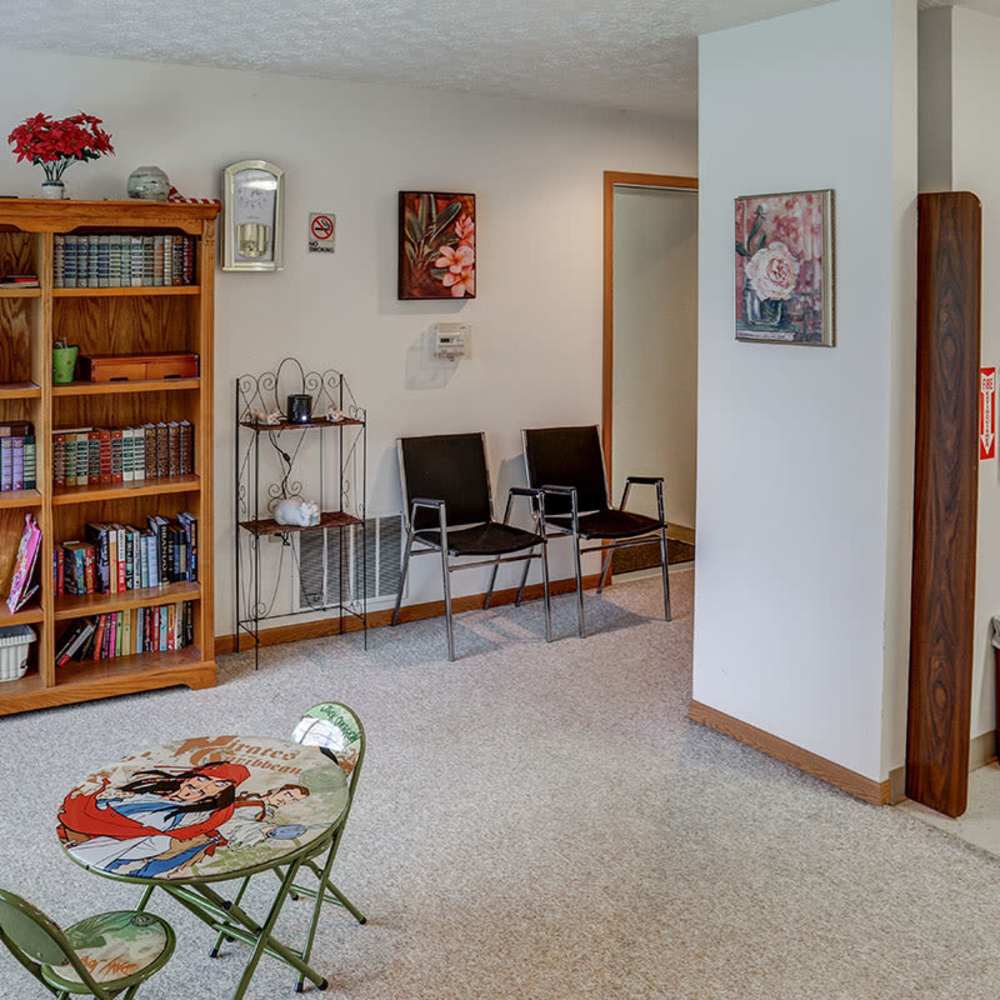 Cozy reading area with bookshelves at Riverview Place in Ripley, Ohio