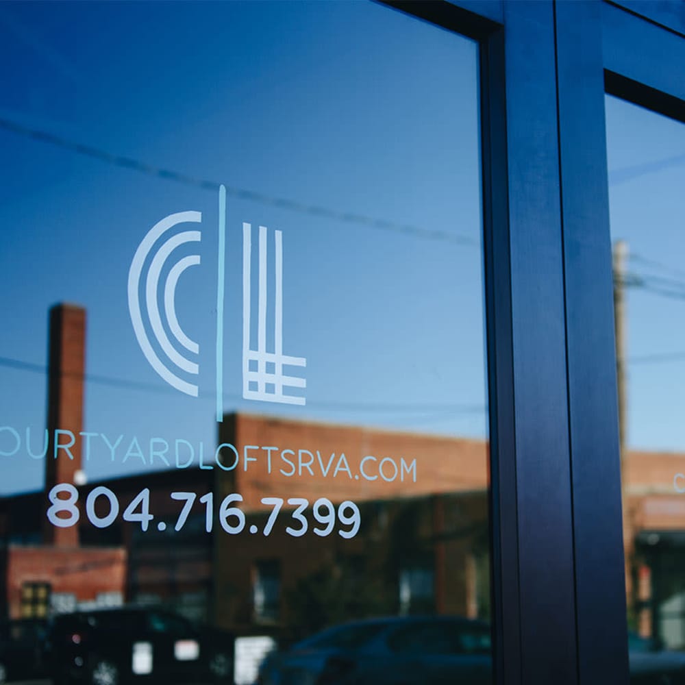 Property number in glass at Courtyard Lofts at Scott’s Addition in Richmond, Virginia