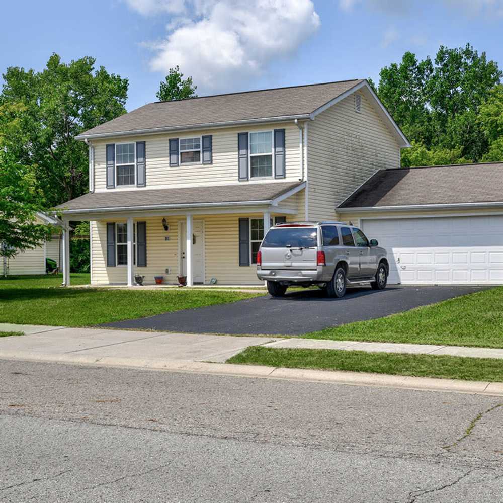 Two-story house with driveway and lawn at Chartwell Greene in Mount Gilead, Ohio