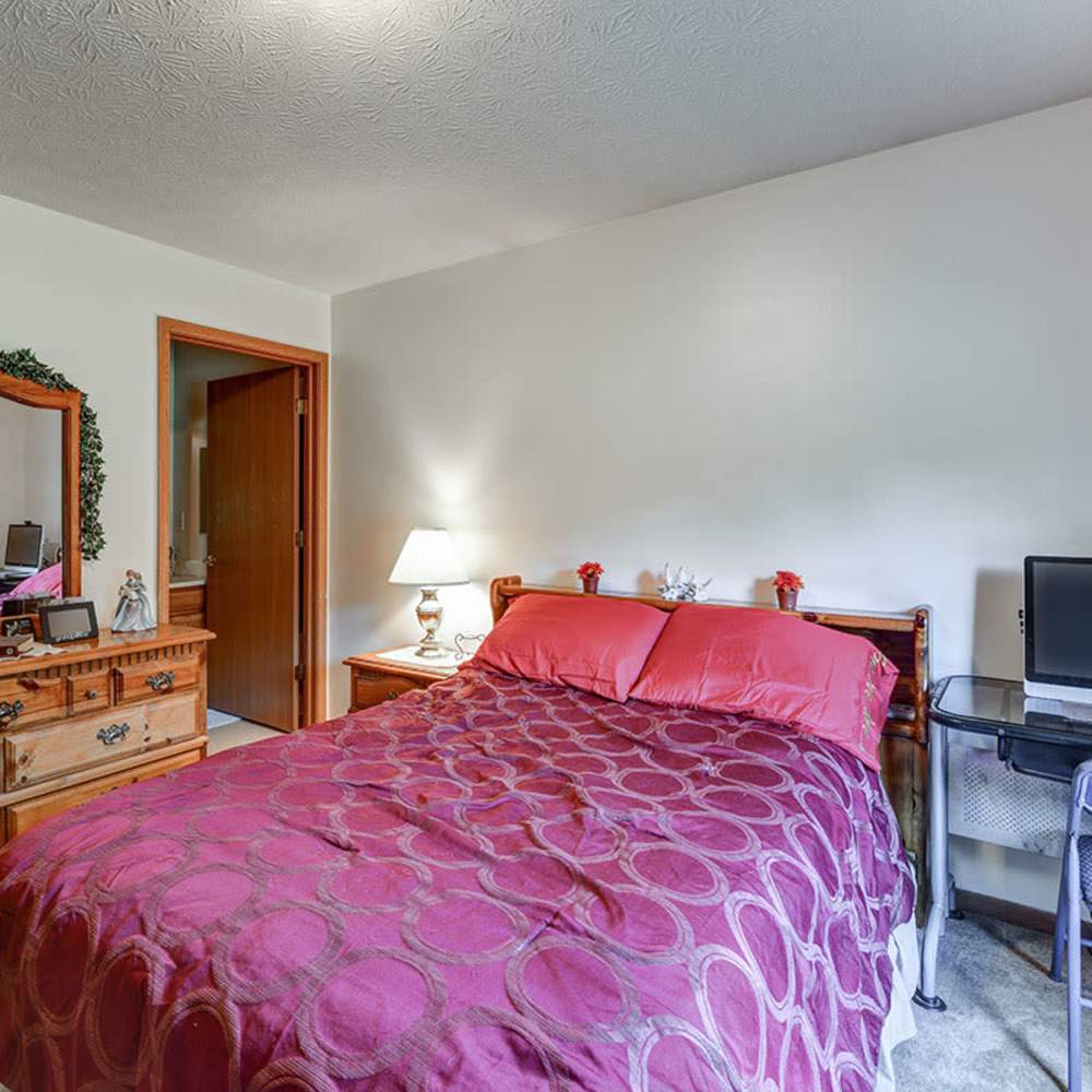 Cozy bedroom with warm lighting at Chartwell Greene in Mount Gilead, Ohio