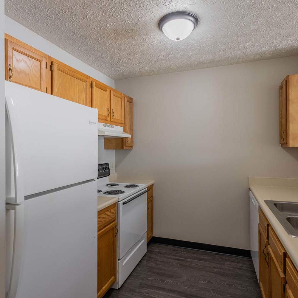Granite countertops and wood-style flooring at Essex Place North in Sycamore, Ohio