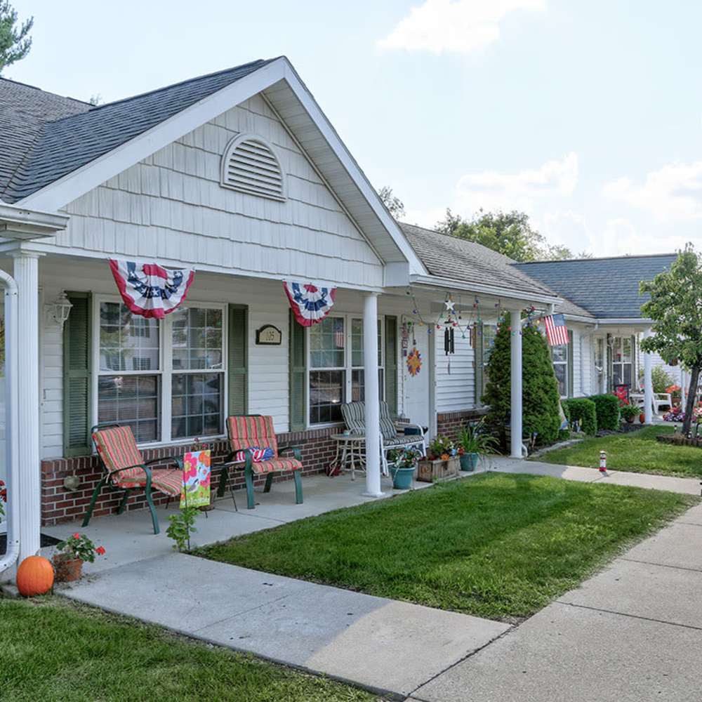 Front porches with seating and festive decor near Meridian Greene I in Wintersville, Ohio