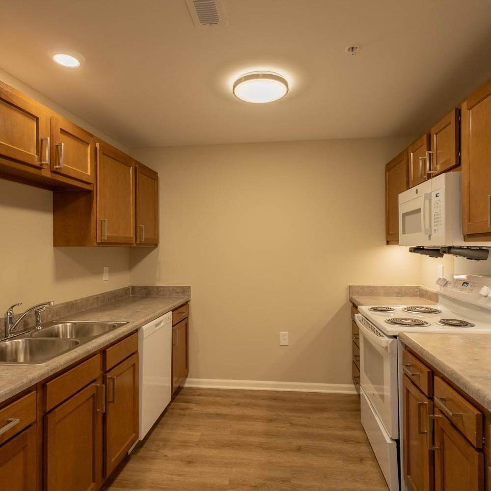 Kitchen with wooden cabinets at Munson Crossing in Zanesville, Ohio 