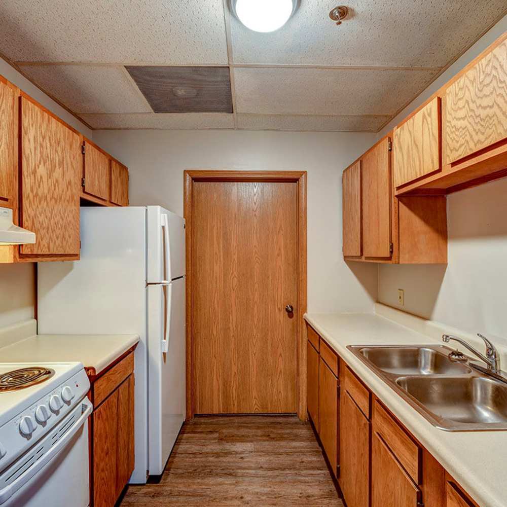 Granite countertops and wood-style flooring at St. Clairsville Courtyard in St. Clairsville, Ohio