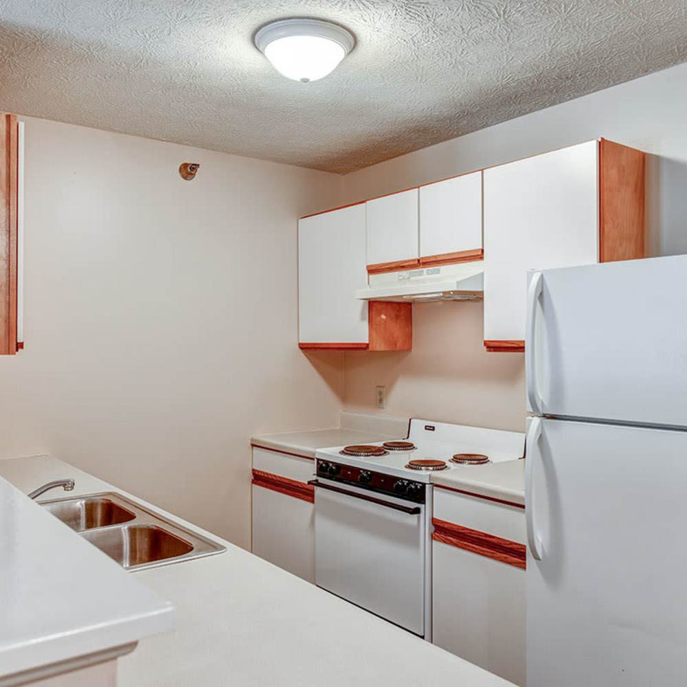 Bright kitchen with white cabinets at Tall Trees in Tiffin, Ohio
