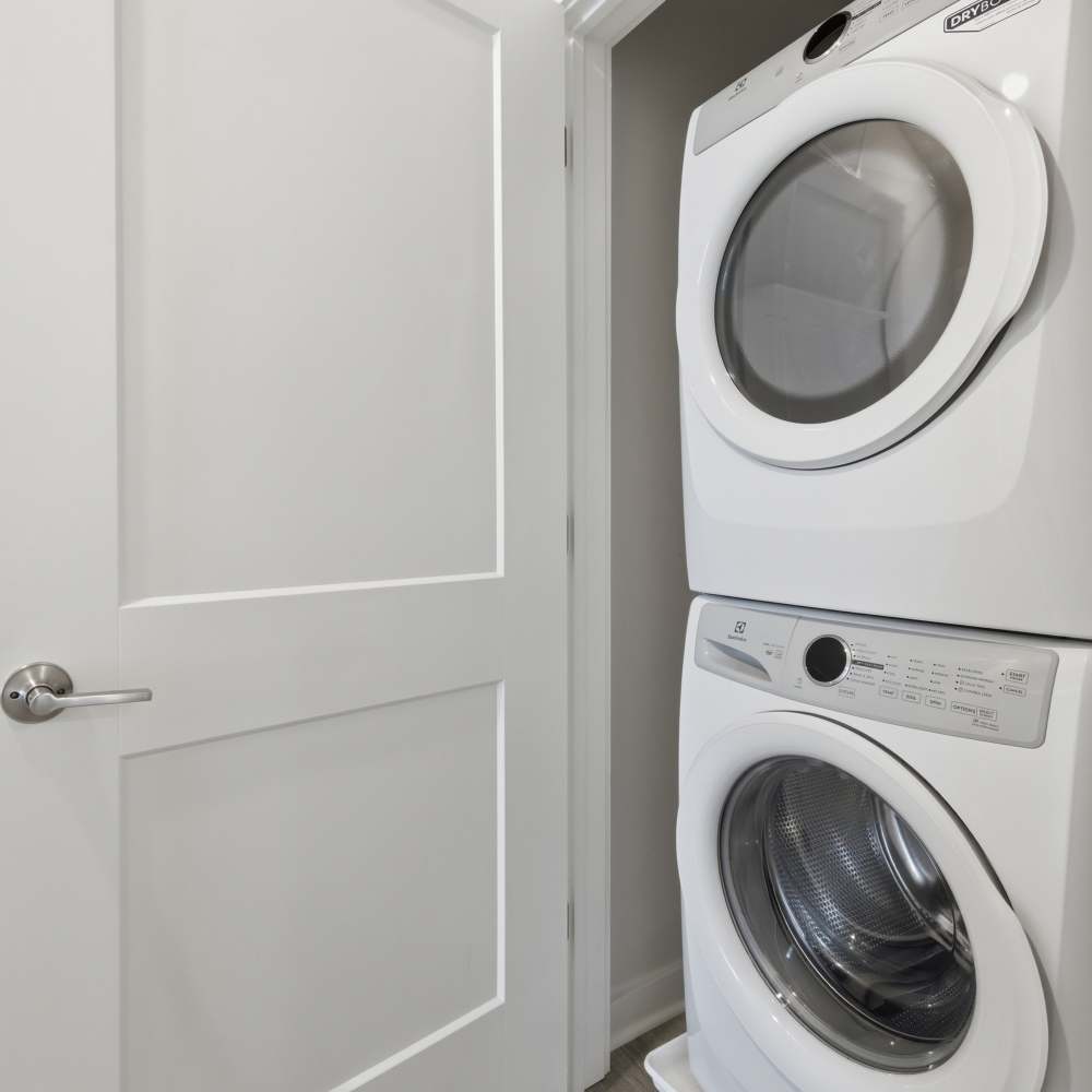 Utility closet with washer and dryer at The Warwick at Foundry Creek in Richmond, VA