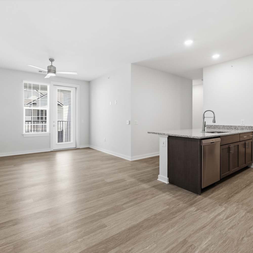 Spacious apartment interior with wooden flooring at The Warwick at Foundry Creek in Richmond, VA