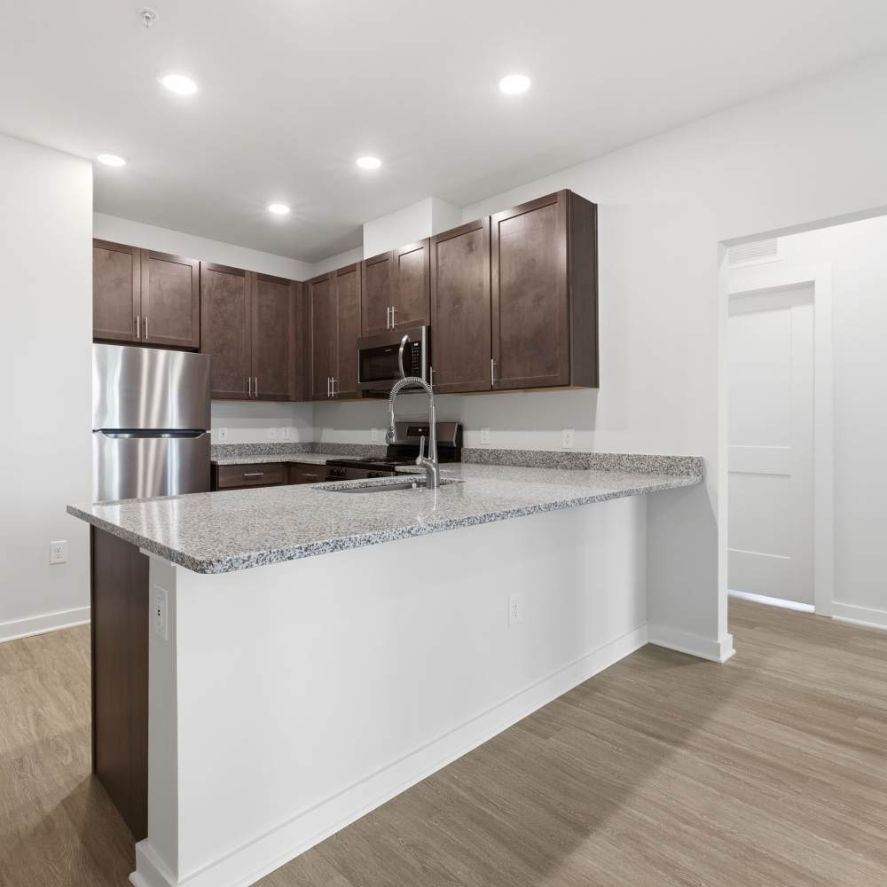 Modern kitchen with spacious countertop at The Warwick at Foundry Creek in Richmond, VA