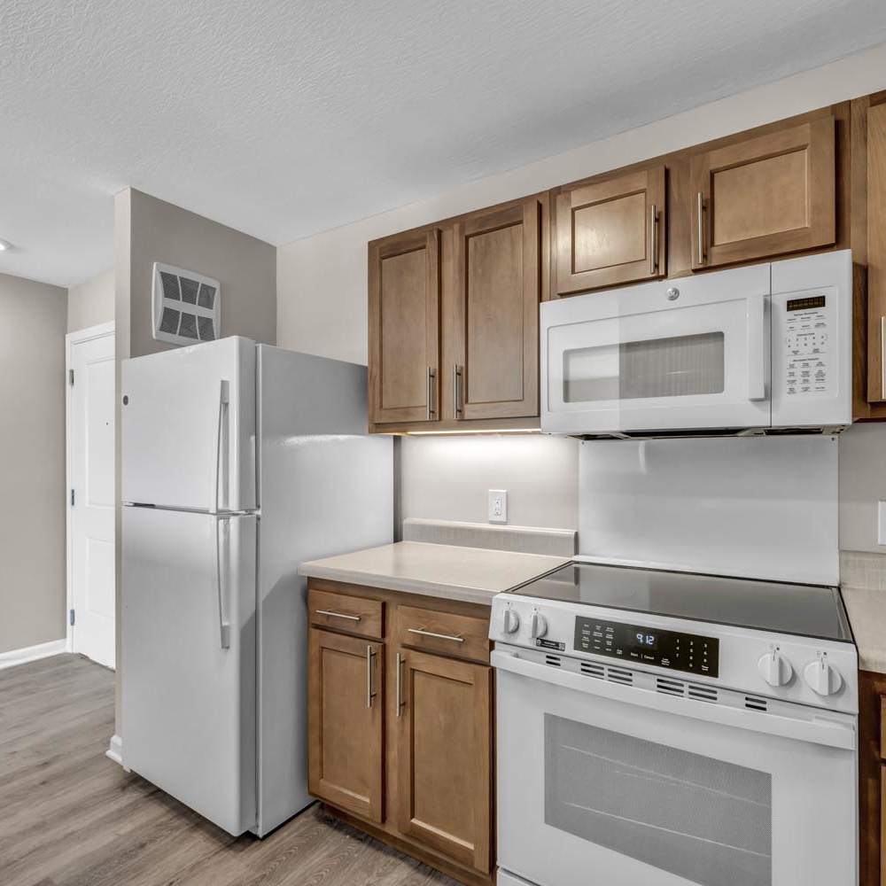 Bright kitchen with stainless steel appliances at Newton Family Apartments in Canton, Ohio