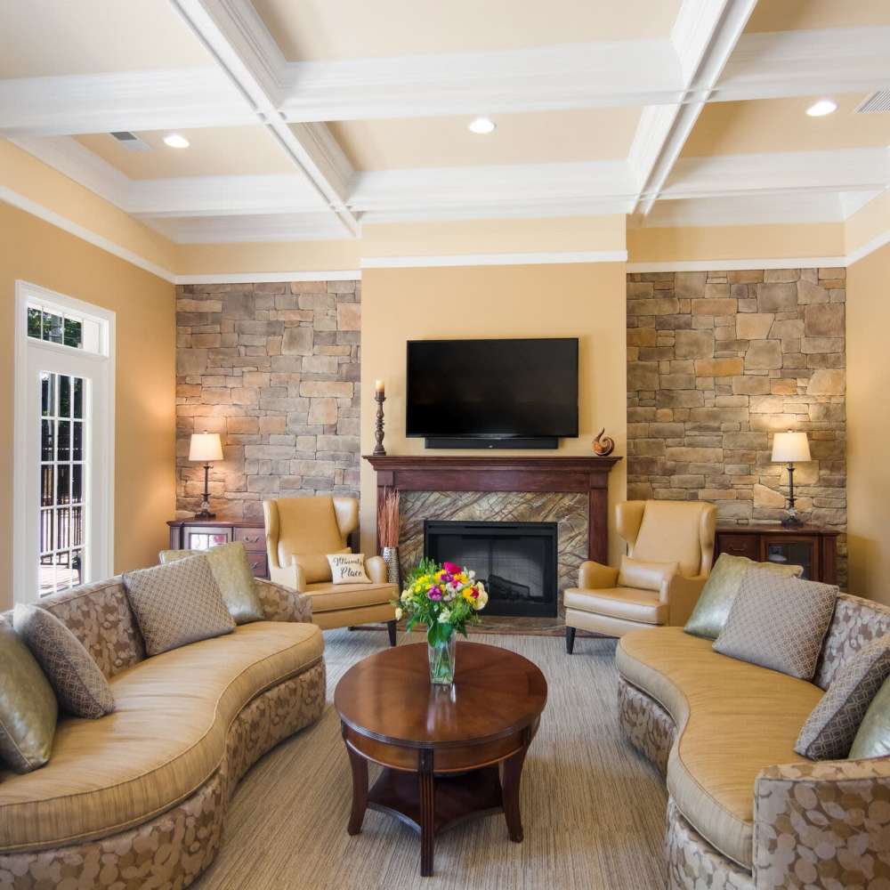 Lounge area with seating and fireplace at Waverly Place in Louisa, Virginia