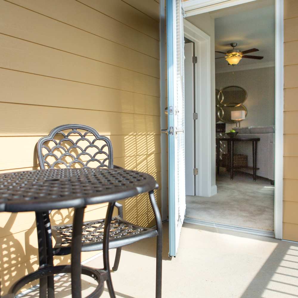 Private patio with seating area at The Apartments at Goose Creek in Fishersville, Virginia