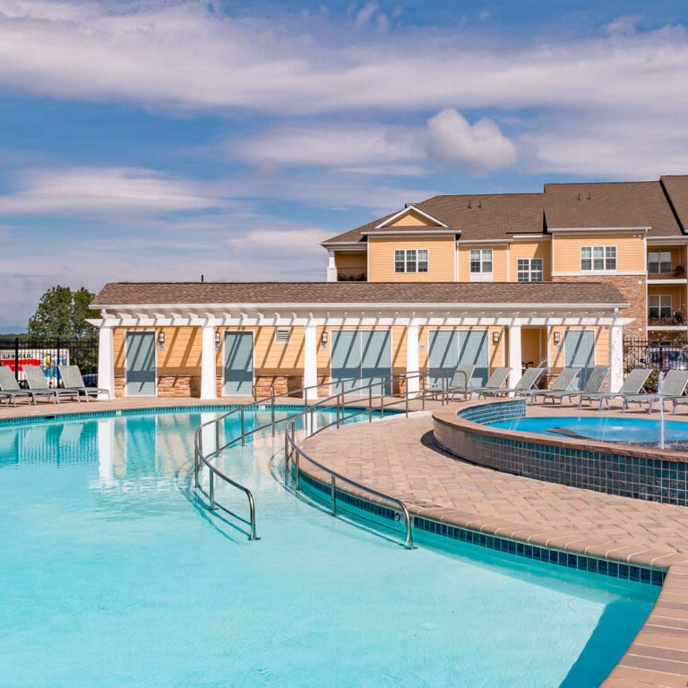 Swimming pool with spa  at The Apartments at Goose Creek in Fishersville, Virginia
