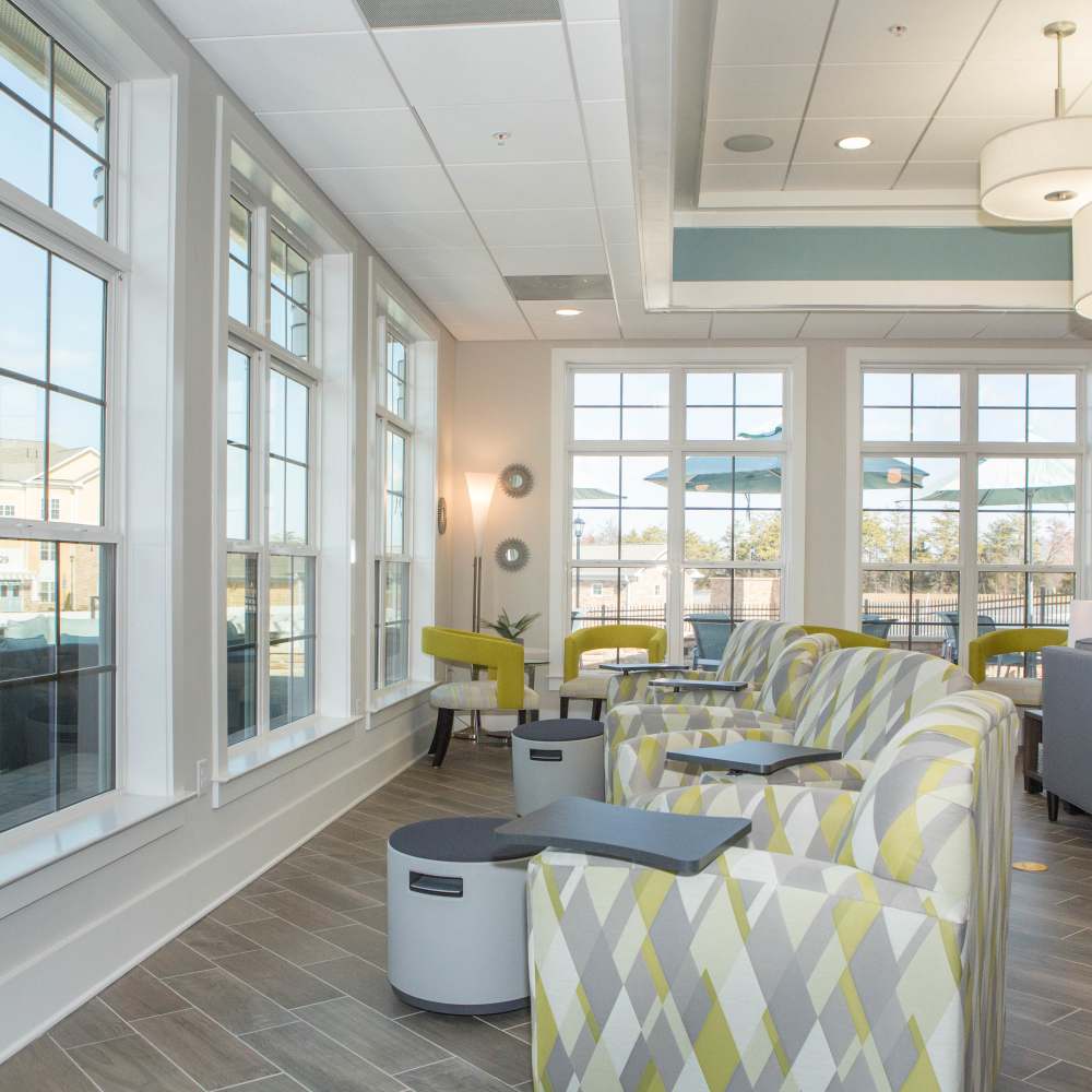 Clubhouse with lounge seating area at The Apartments at Goose Creek in Fishersville, Virginia