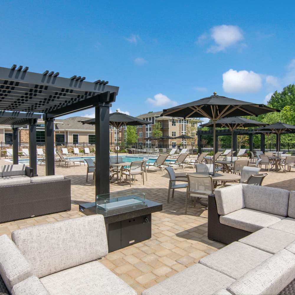 Outdoor lounge area with seating spaces at The Knoll at Stone View in Ruckersville, Virginia