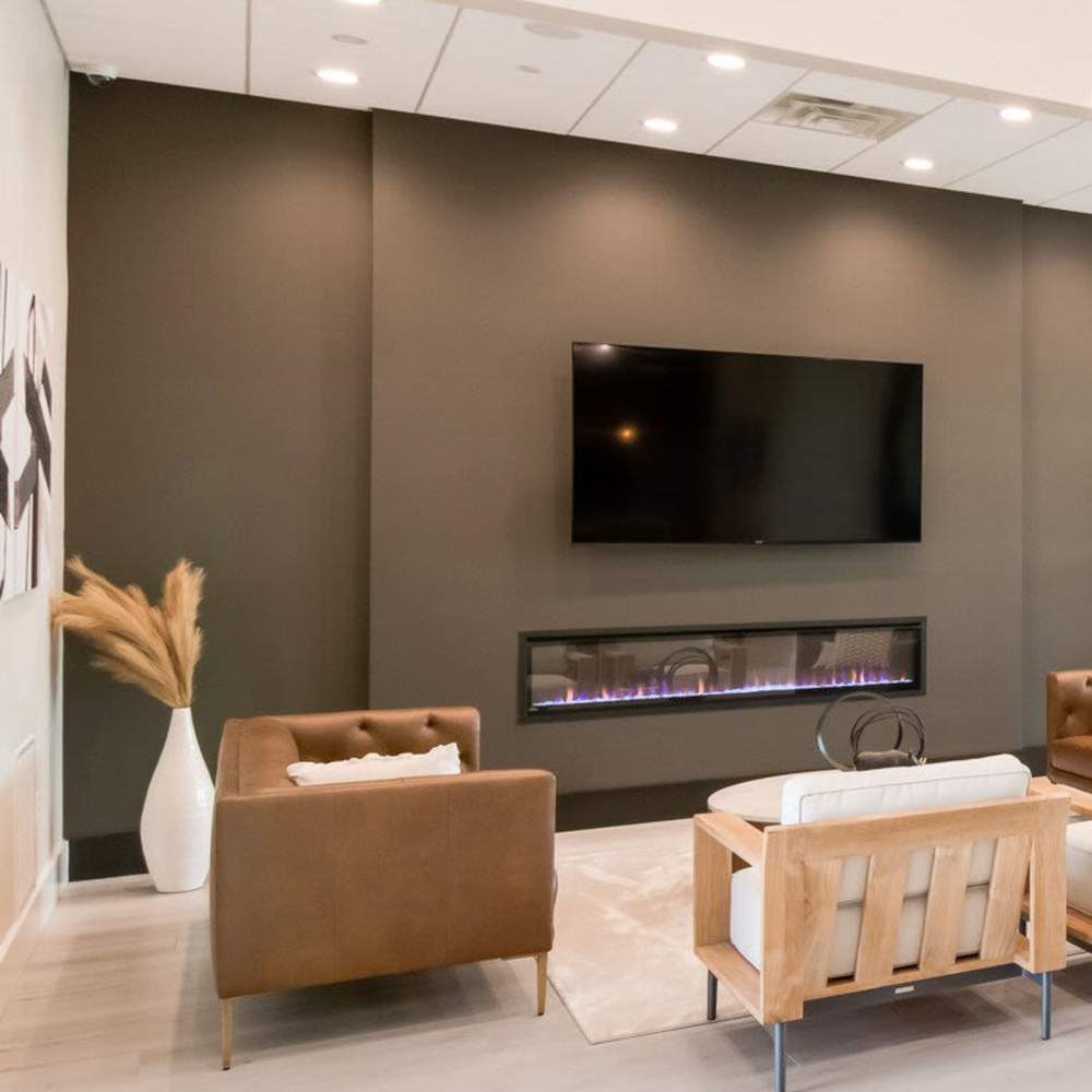 Clubhouse with television and lounge seating for community at The Knoll at Stone View in Ruckersville, Virginia