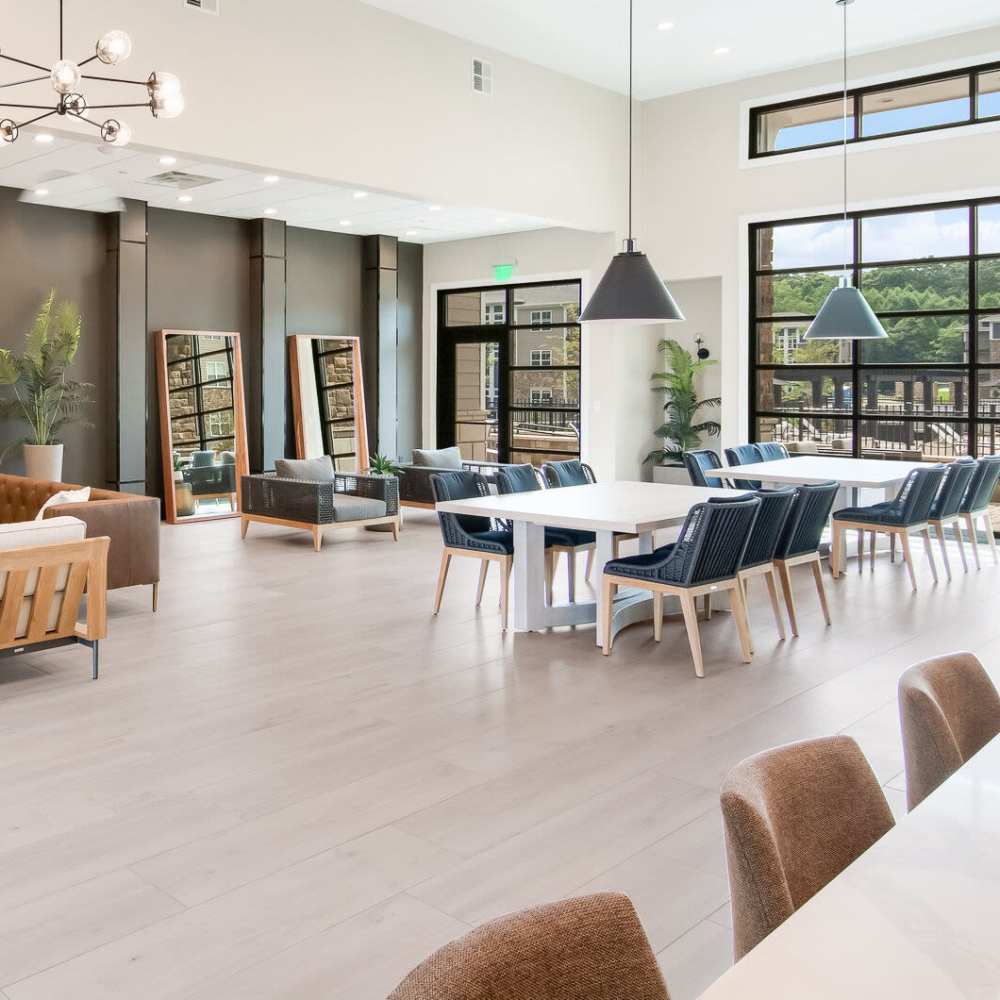 Clubhouse with plenty of seating for community and full height window at The Knoll at Stone View in Ruckersville, Virginia