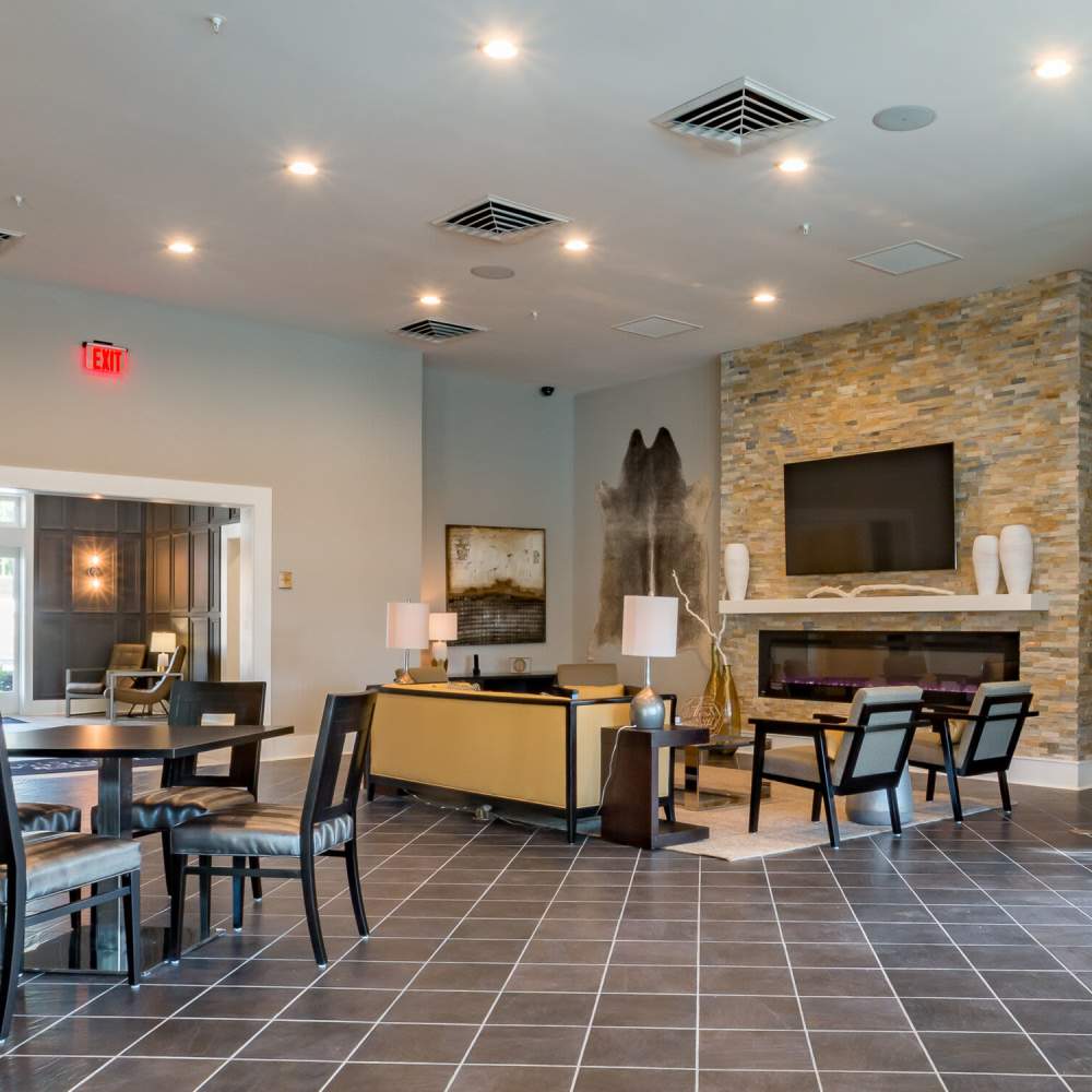 Clubhouse with seating area and fireplace at Stonegate at the Crossroads in Zion Crossroads, Virginia