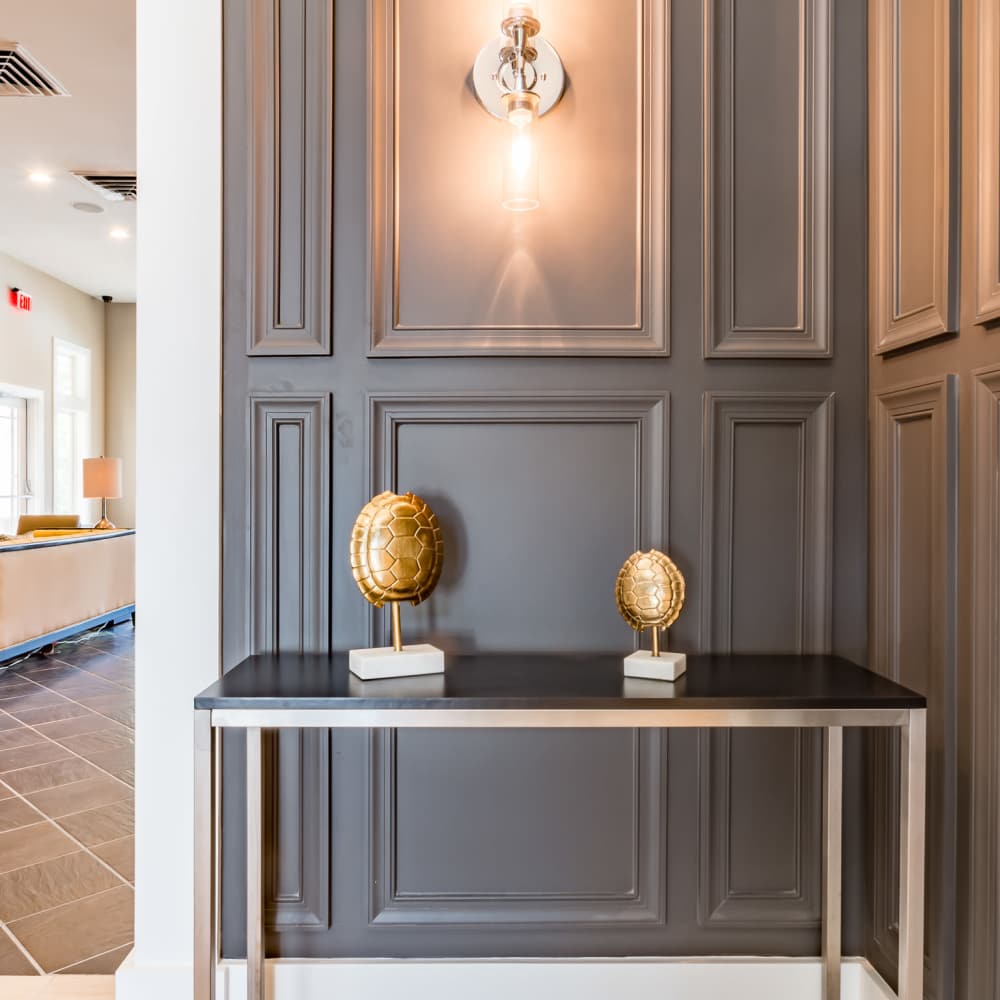 Decorative console table with wall sconce at Stonegate at the Crossroads in Zion Crossroads, Virginia