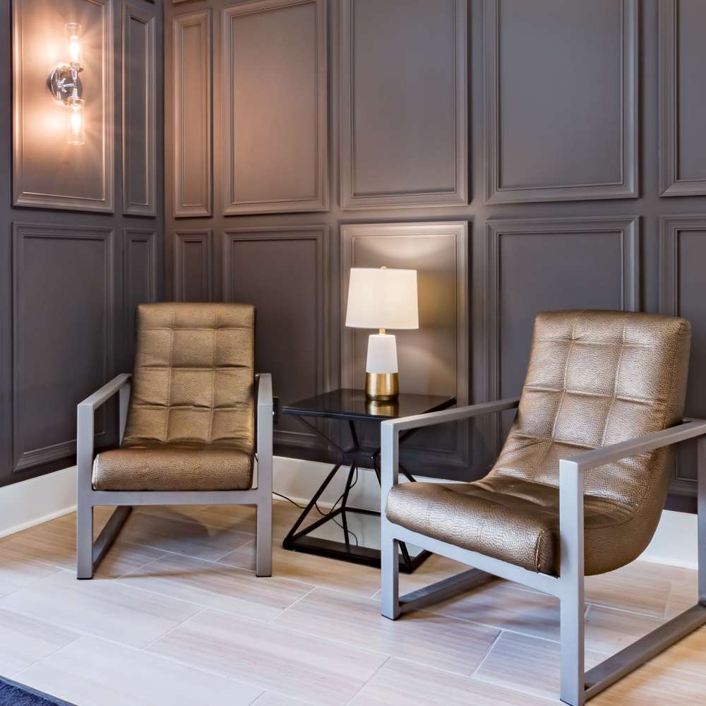 Stylish seating area with modern chairs at Stonegate at the Crossroads in Zion Crossroads, Virginia