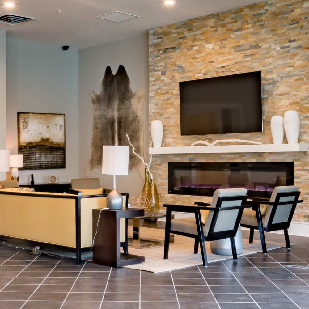 Modern lounge area with fireplace at Stonegate at the Crossroads in Zion Crossroads, Virginia