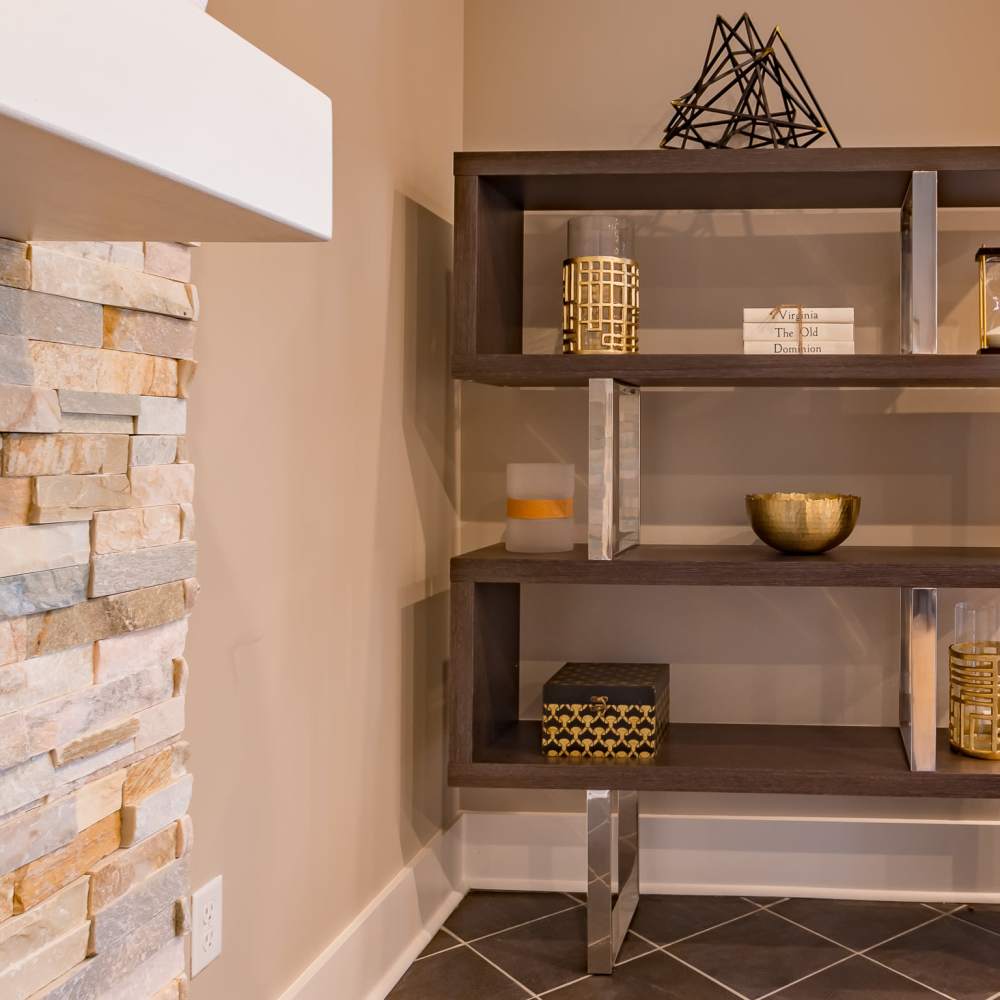 Stylish shelving unit with decorative accents at Stonegate at the Crossroads in Zion Crossroads, Virginia