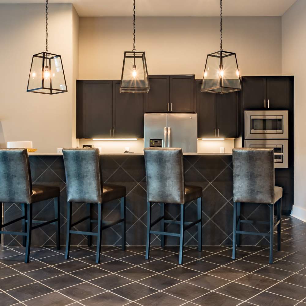 Modern kitchen with island and pendant lights at Stonegate at the Crossroads in Zion Crossroads, Virginia