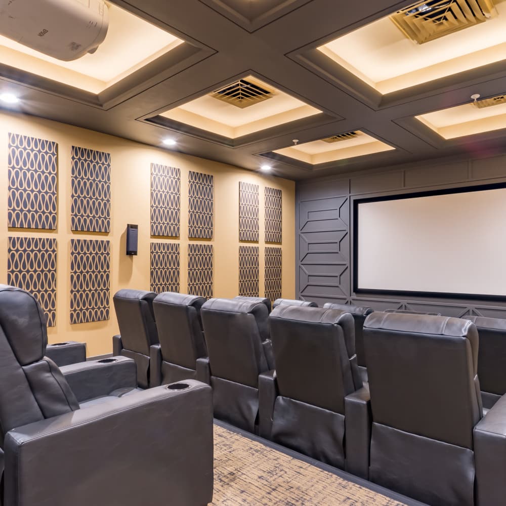 Home theater seating with large screen at Stonegate at the Crossroads in Zion Crossroads, Virginia