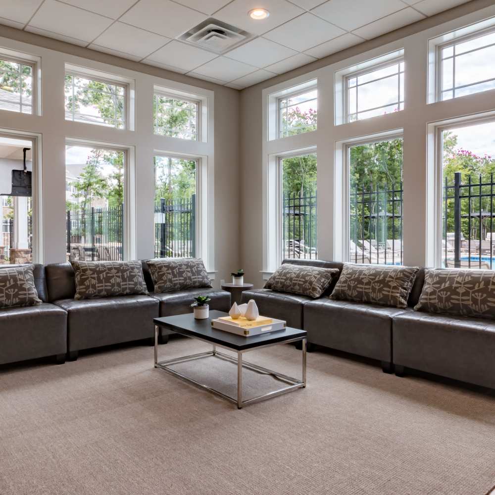 Lounge area with large windows at Stonegate at the Crossroads in Zion Crossroads, Virginia