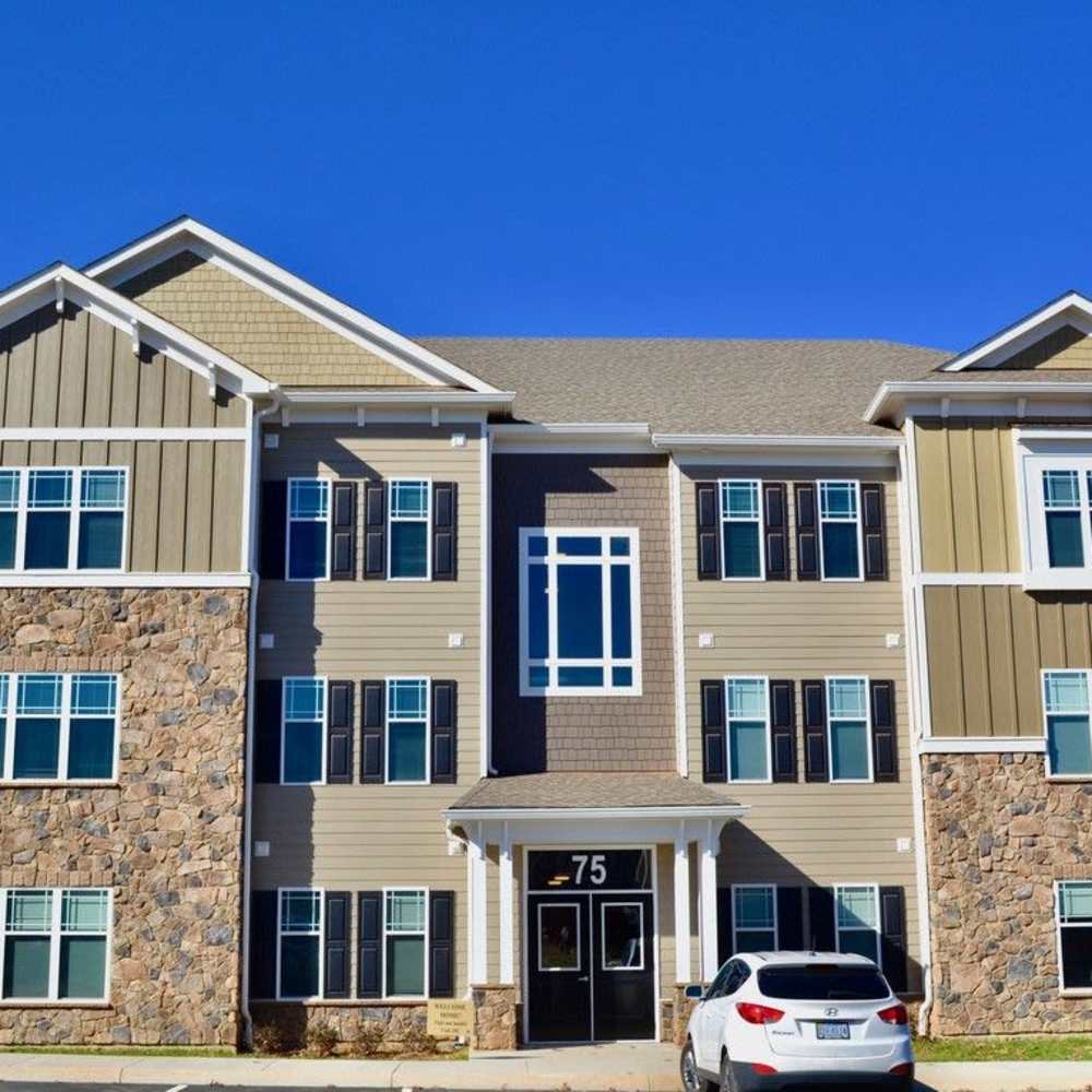 Building exterior with stone accents at Stonegate at the Crossroads in Zion Crossroads, Virginia