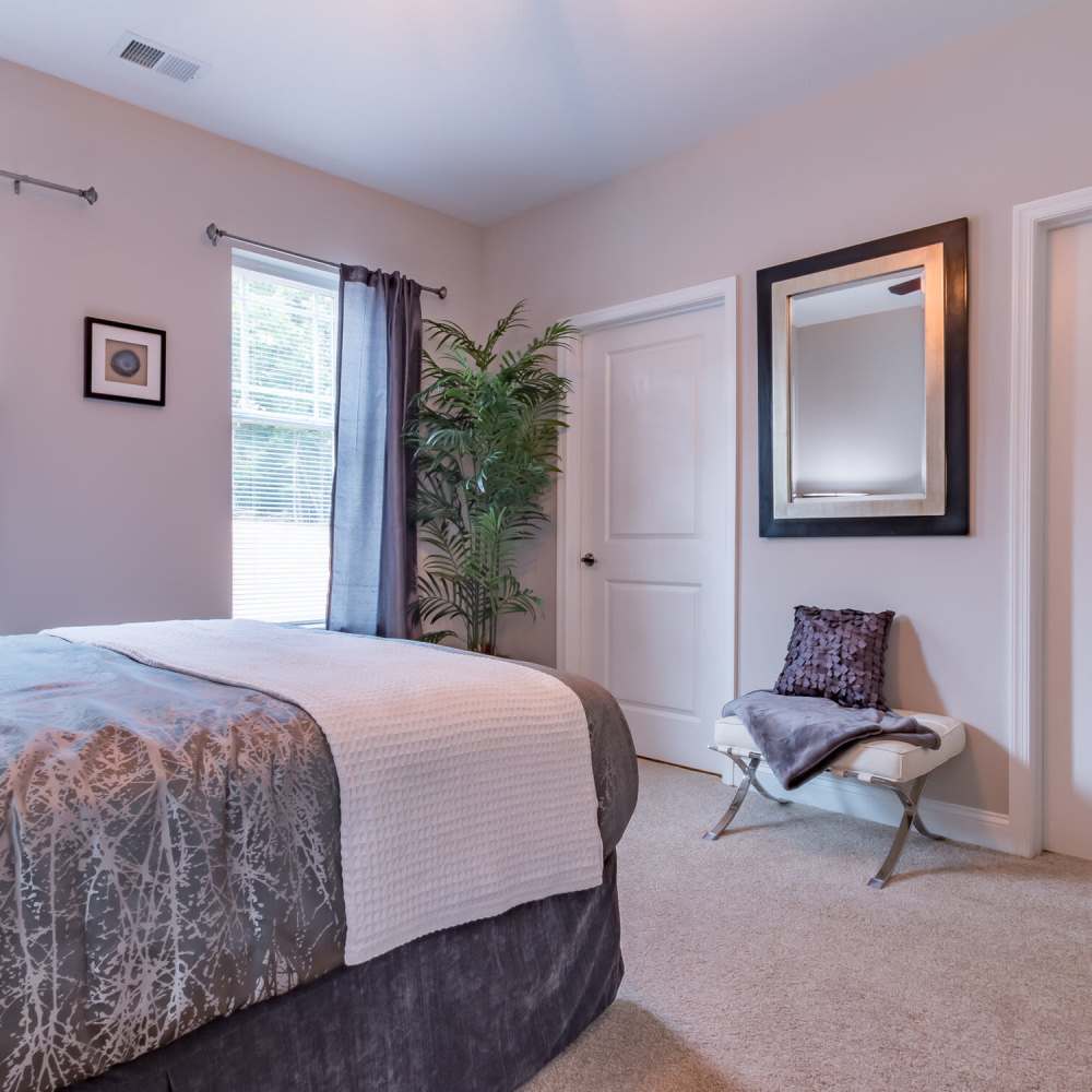 Cozy bedroom with soft carpet at Stonegate at the Crossroads in Zion Crossroads, Virginia