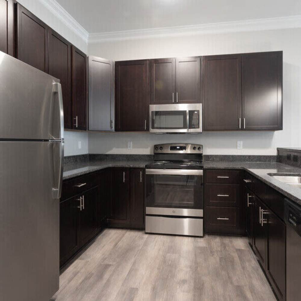 Kitchen with wooden flooring  at The Apartments At Kelton Station in Williamsburg, Virginia