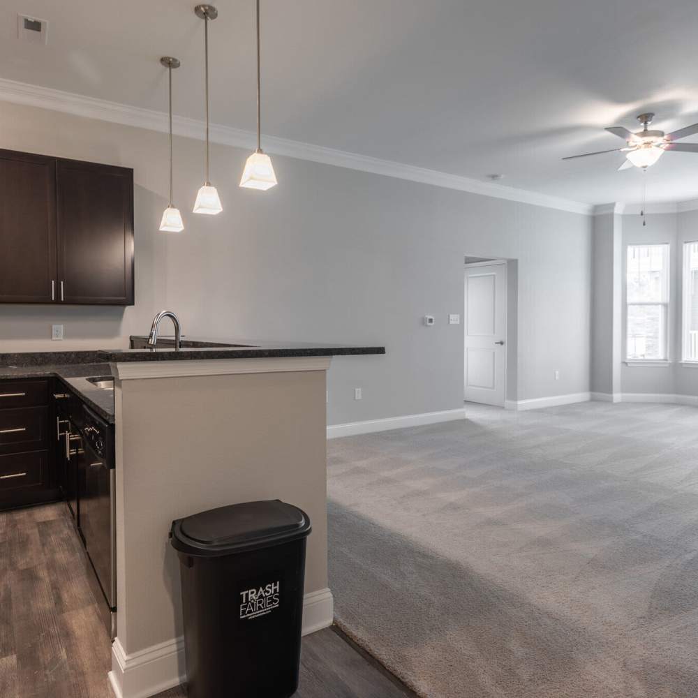 Kitchen with unfurnishes  dining area at The Apartments At Kelton Station in Williamsburg, Virginia