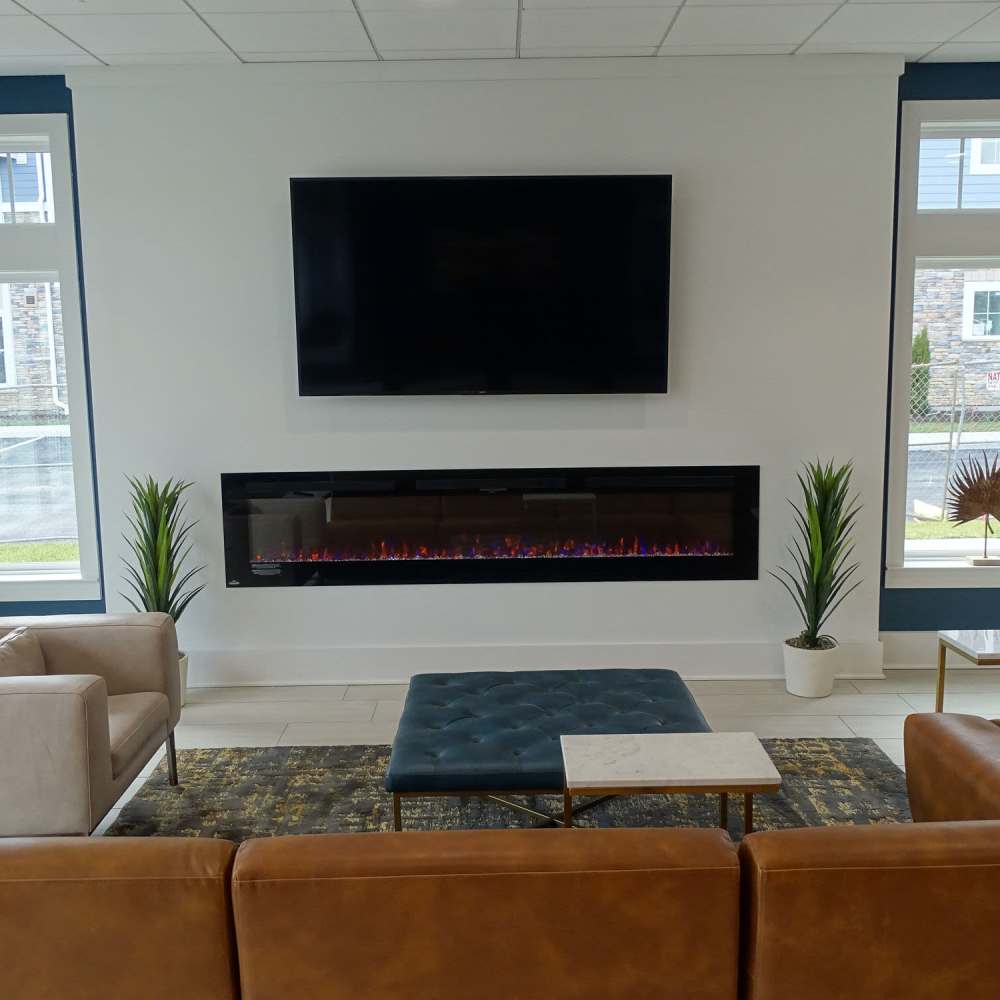 Fireplace in clubhouse at The Apartments At Kelton Station in Williamsburg, Virginia