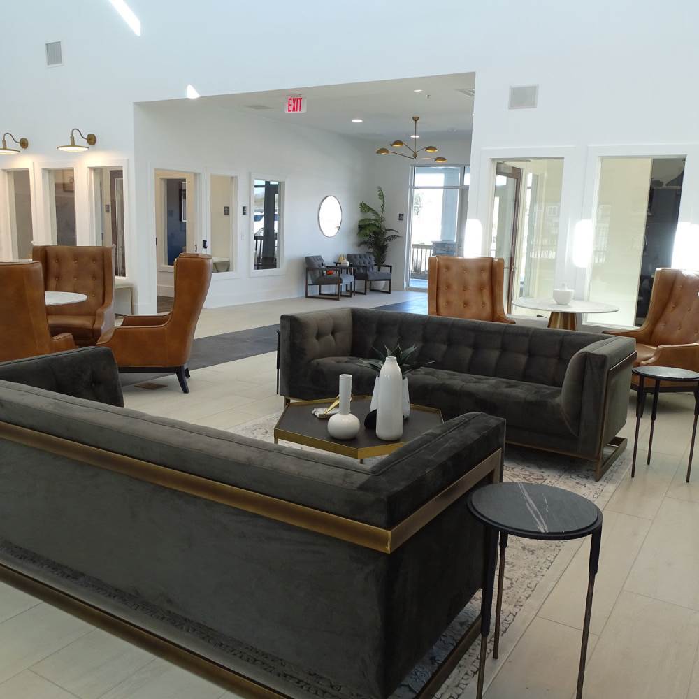 Lounge area in clubhouse at The Apartments At Kelton Station in Williamsburg, Virginia