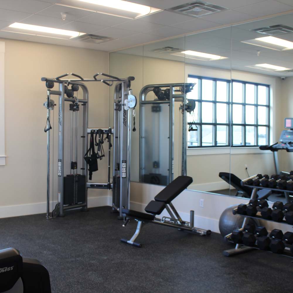 Fitness center with weight machine at The Adams at Peppers Ferry in , Virginia