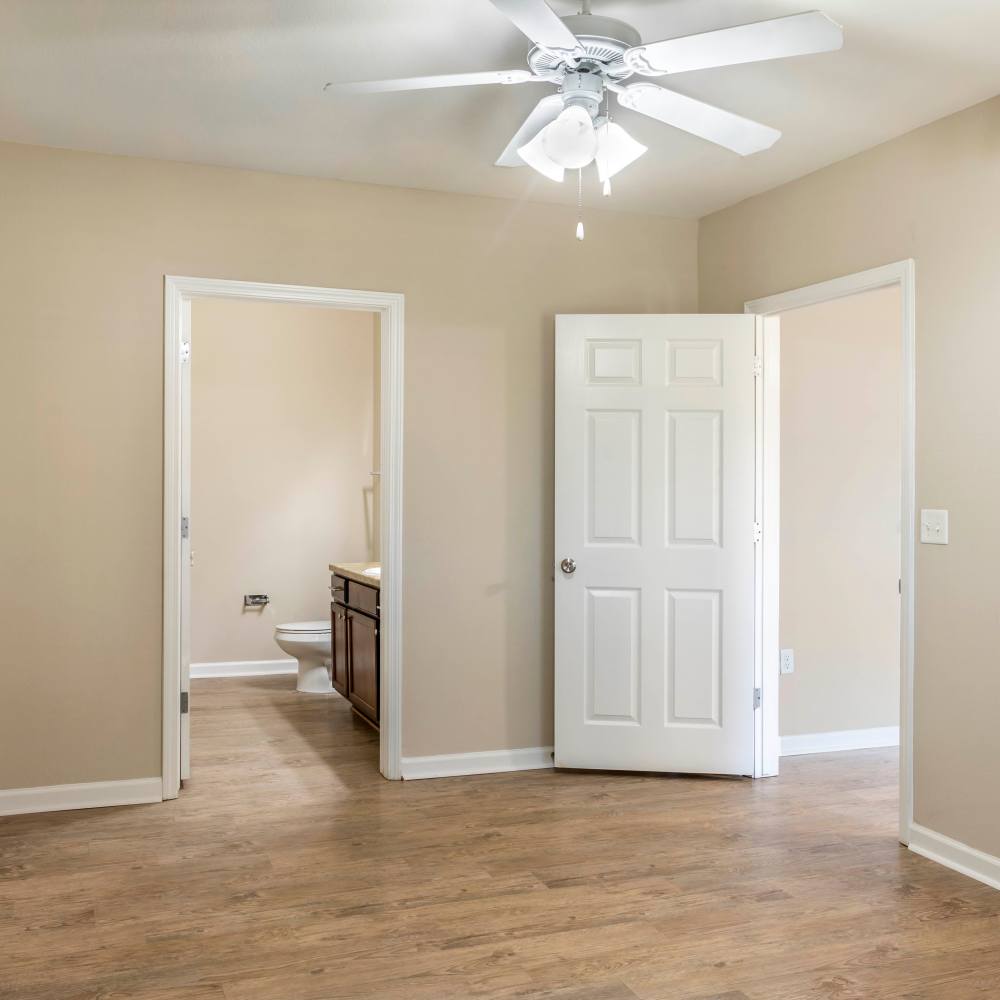 Bedroom with adjoining bathroom at Chenal Pointe at the Divide in Little Rock, Arkansas