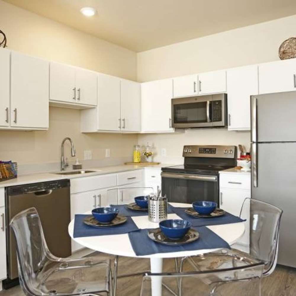 White wood cabinets in the kitchen at WaterWalk Raleigh - RTP in Morrisville, North Carolina