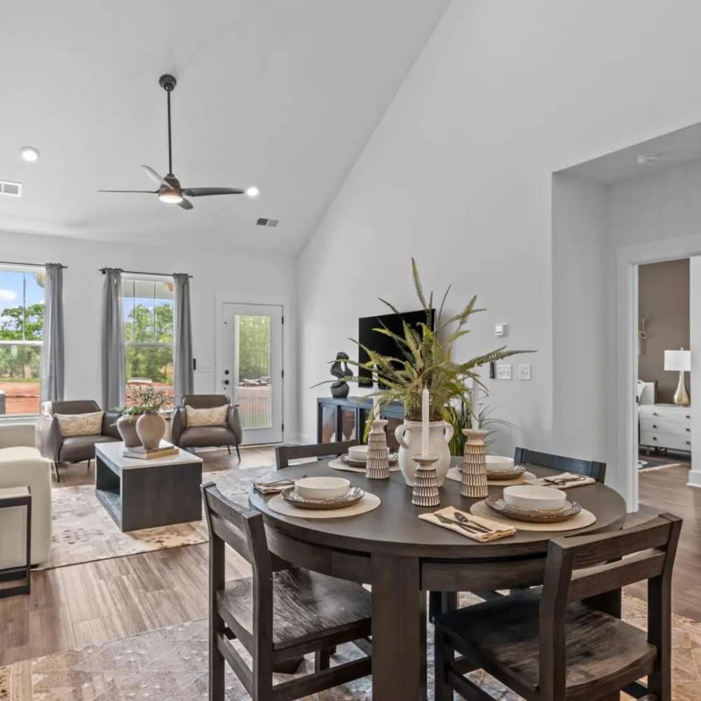 Dining area and living room at The Wilds at Cedar Mountain in Asheville, North Carolina